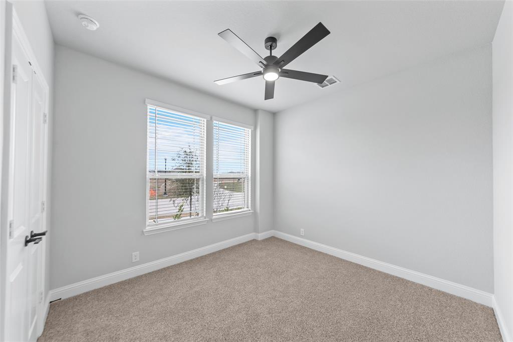 3405 Heathrow Road Mesquite, TX 75181 - Photo 26 of 30 an empty room with a window and a fan