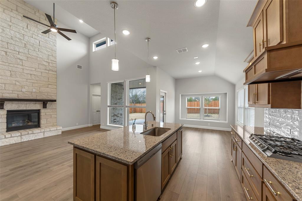 3405 Heathrow Road Mesquite, TX 75181 - Photo 7 of 30 a kitchen with granite countertop a sink cabinets and wooden floor