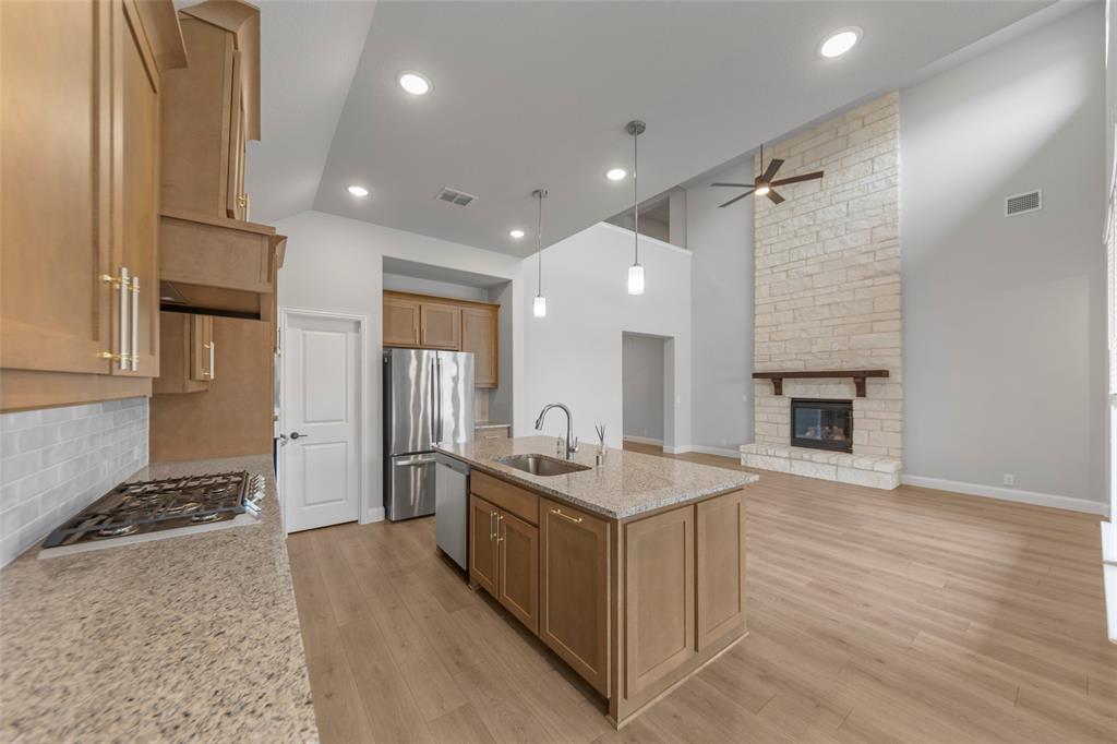 3405 Heathrow Road Mesquite, TX 75181 - Photo 9 of 30 a kitchen with stainless steel appliances granite countertop a sink stove and refrigerator
