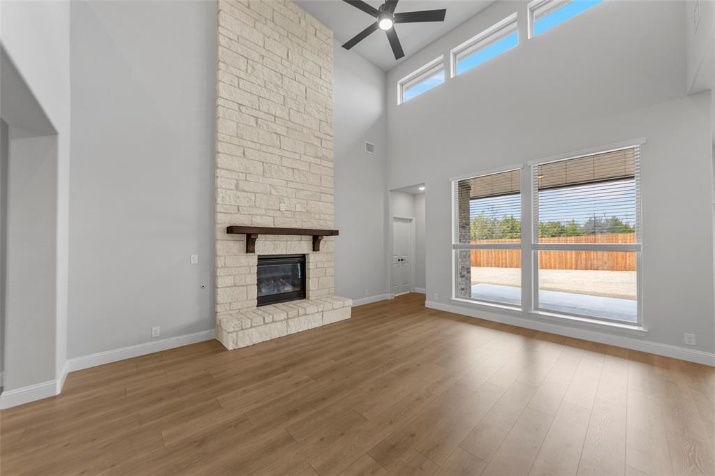 3405 Heathrow Road Mesquite, TX 75181 - Photo 10 of 30 wooden floor fireplace and windows in an empty room