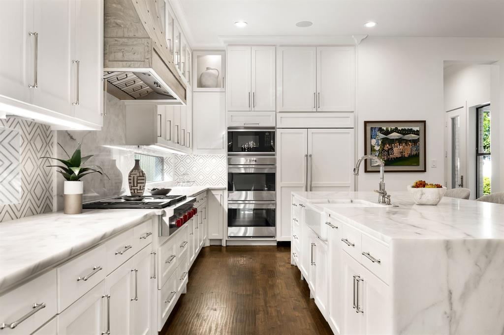 4635 West Amherst Avenue Dallas, TX 75209 - Photo 11 of 36 a kitchen with stainless steel appliances granite countertop a stove and a white cabinets