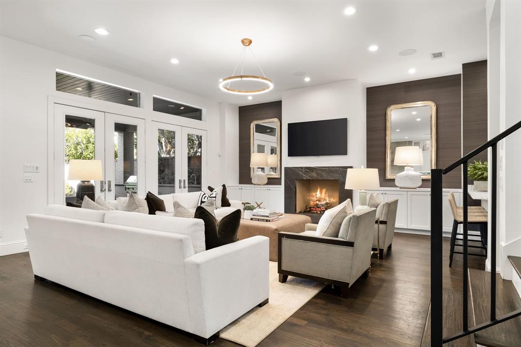 4635 West Amherst Avenue Dallas, TX 75209 - Photo 14 of 36 a living room with fireplace furniture and a flat screen tv