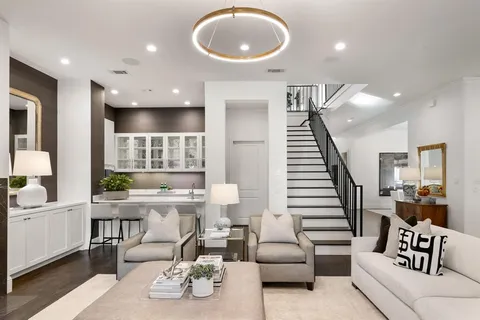 a living room with a table and chairs