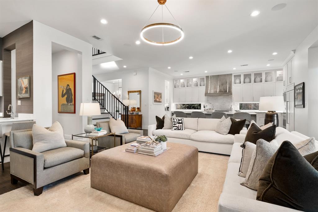 4635 West Amherst Avenue Dallas, TX 75209 - Photo 18 of 36 a living room with furniture kitchen view and a chandelier