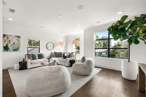 a living room with fireplace furniture and a flat screen tv