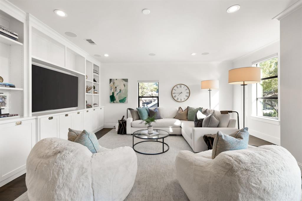 4635 West Amherst Avenue Dallas, TX 75209 - Photo 20 of 36 a living room with fireplace furniture and a flat screen tv
