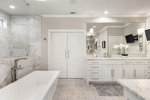 a bathroom with a bathtub and shower