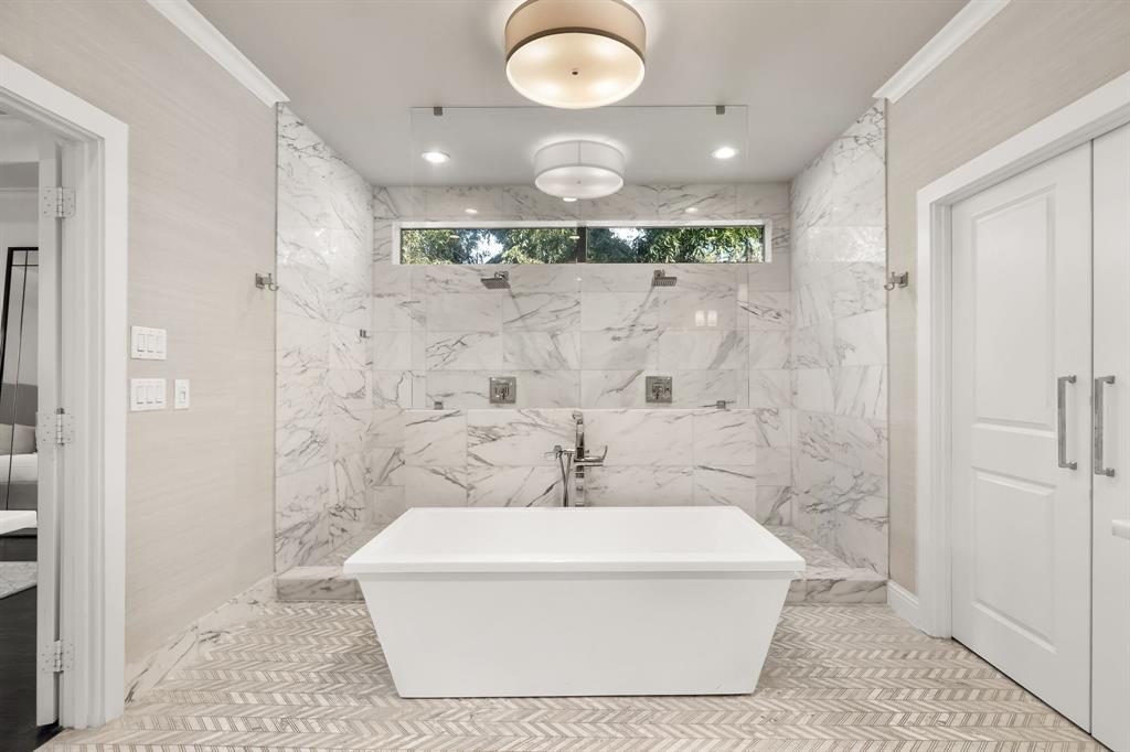 4635 West Amherst Avenue Dallas, TX 75209 - Photo 27 of 36 a bathroom with a bathtub and shower