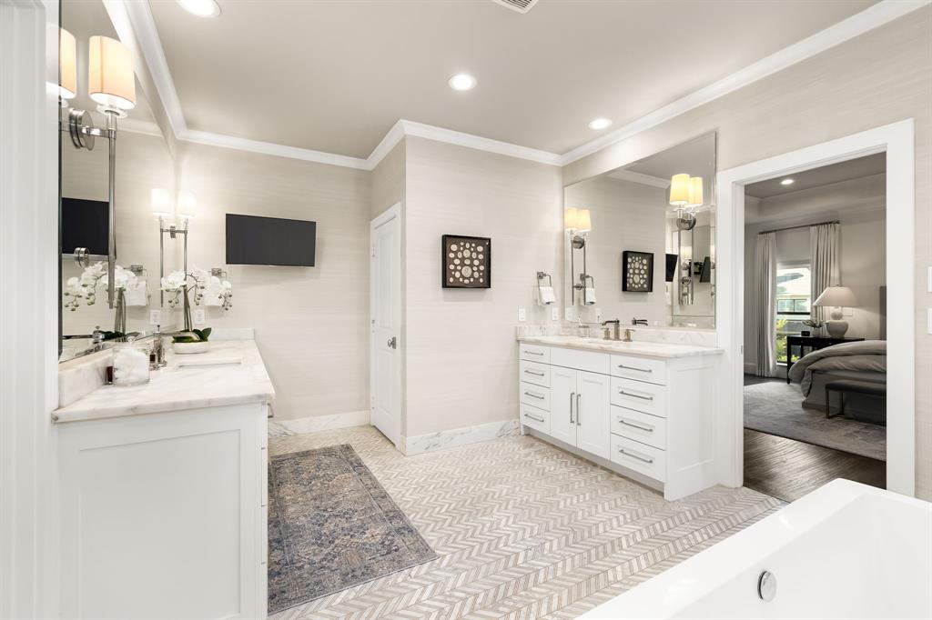 4635 West Amherst Avenue Dallas, TX 75209 - Photo 28 of 36 a bathroom with a sink a toilet and mirror