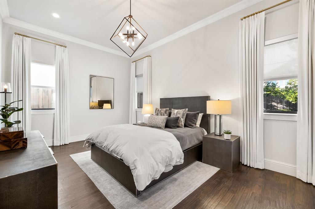 4635 West Amherst Avenue Dallas, TX 75209 - Photo 29 of 36 a bedroom with a large bed and a window