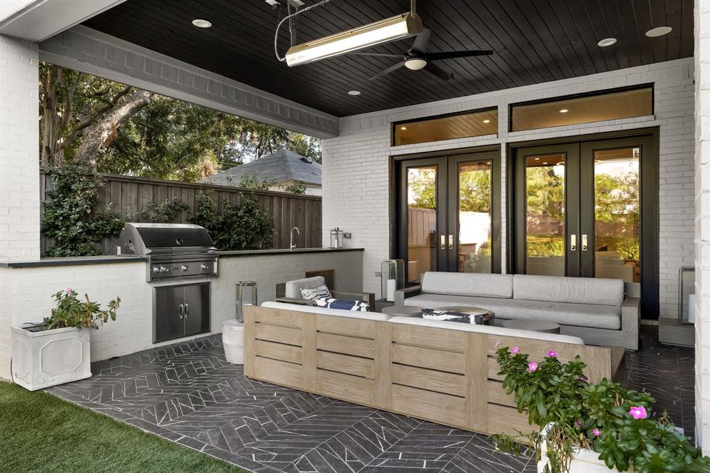 4635 West Amherst Avenue Dallas, TX 75209 - Photo 31 of 36 a living room with stainless steel appliances furniture and a large window