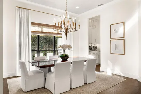 a living room with furniture and large windows