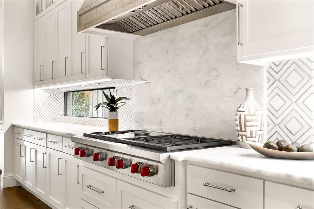 4635 West Amherst Avenue Dallas, TX 75209 - Photo 9 of 36 a white stove top oven sitting inside of a kitchen
