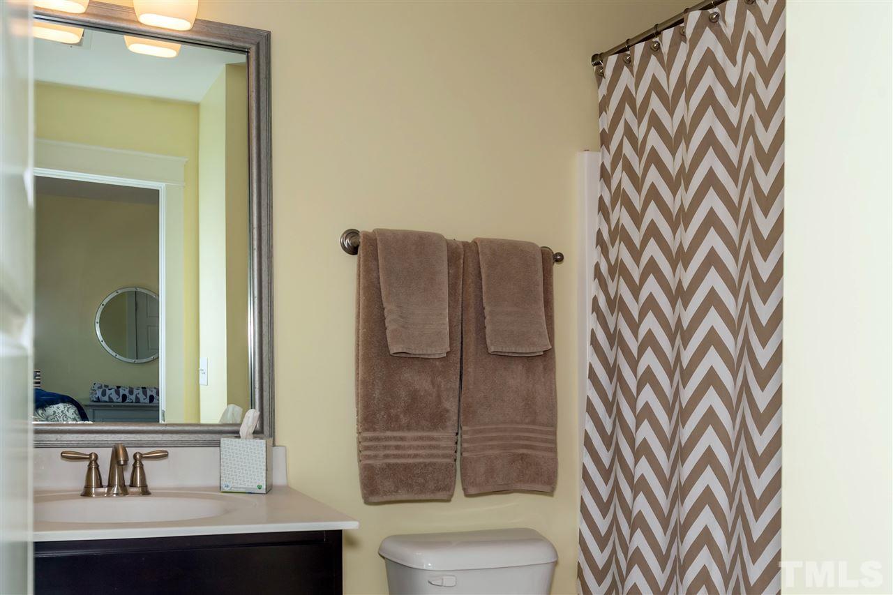 7811 Lillyhurst Drive Raleigh, NC 27612 - Photo 19 of 25 a bathroom with a sink a toilet and shower