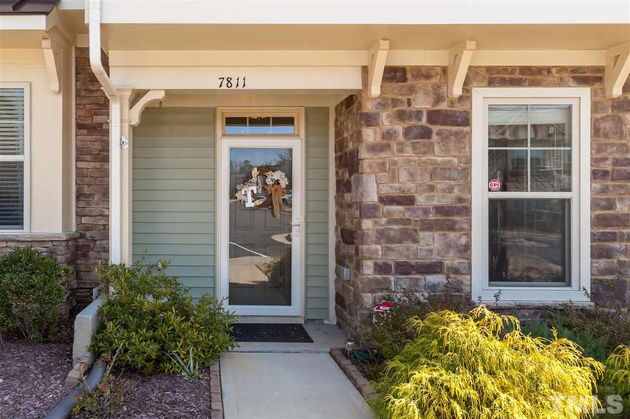 7811 Lillyhurst Drive Raleigh, NC 27612 - Photo 3 of 25 a view of front door and potted plants