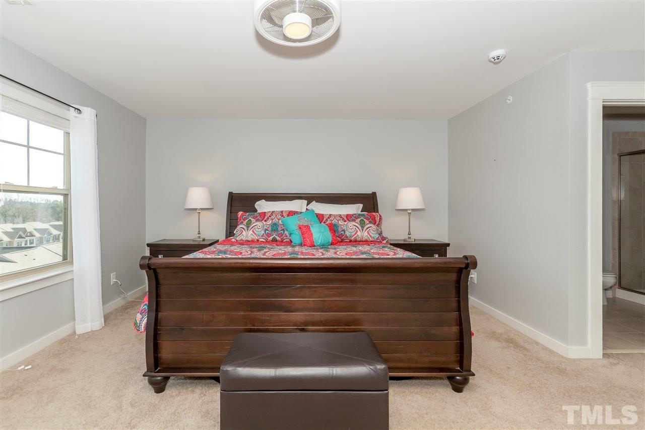 7811 Lillyhurst Drive Raleigh, NC 27612 - Photo 22 of 25 a room with a table and couch