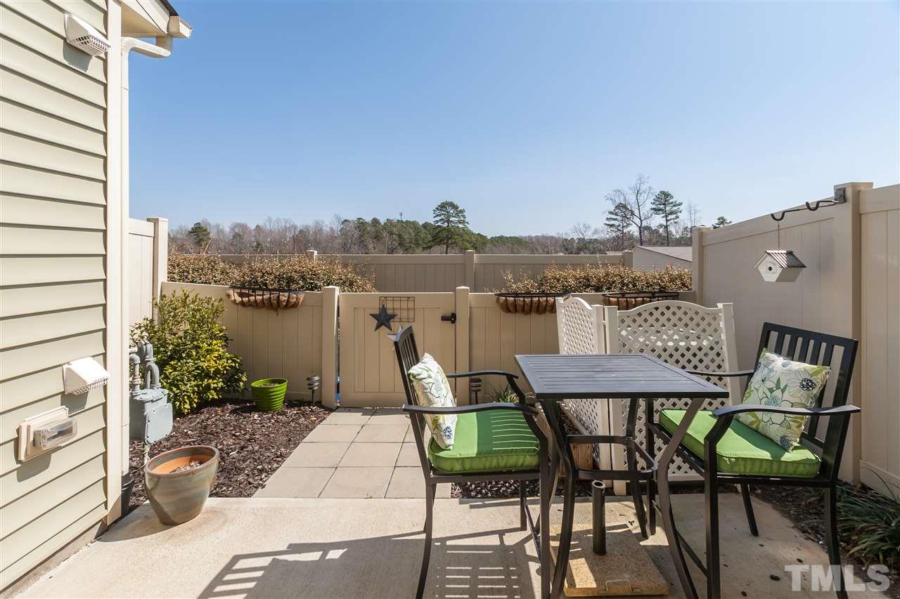 7811 Lillyhurst Drive Raleigh, NC 27612 - Photo 24 of 25 a view of a terrace with furniture and a potted plant