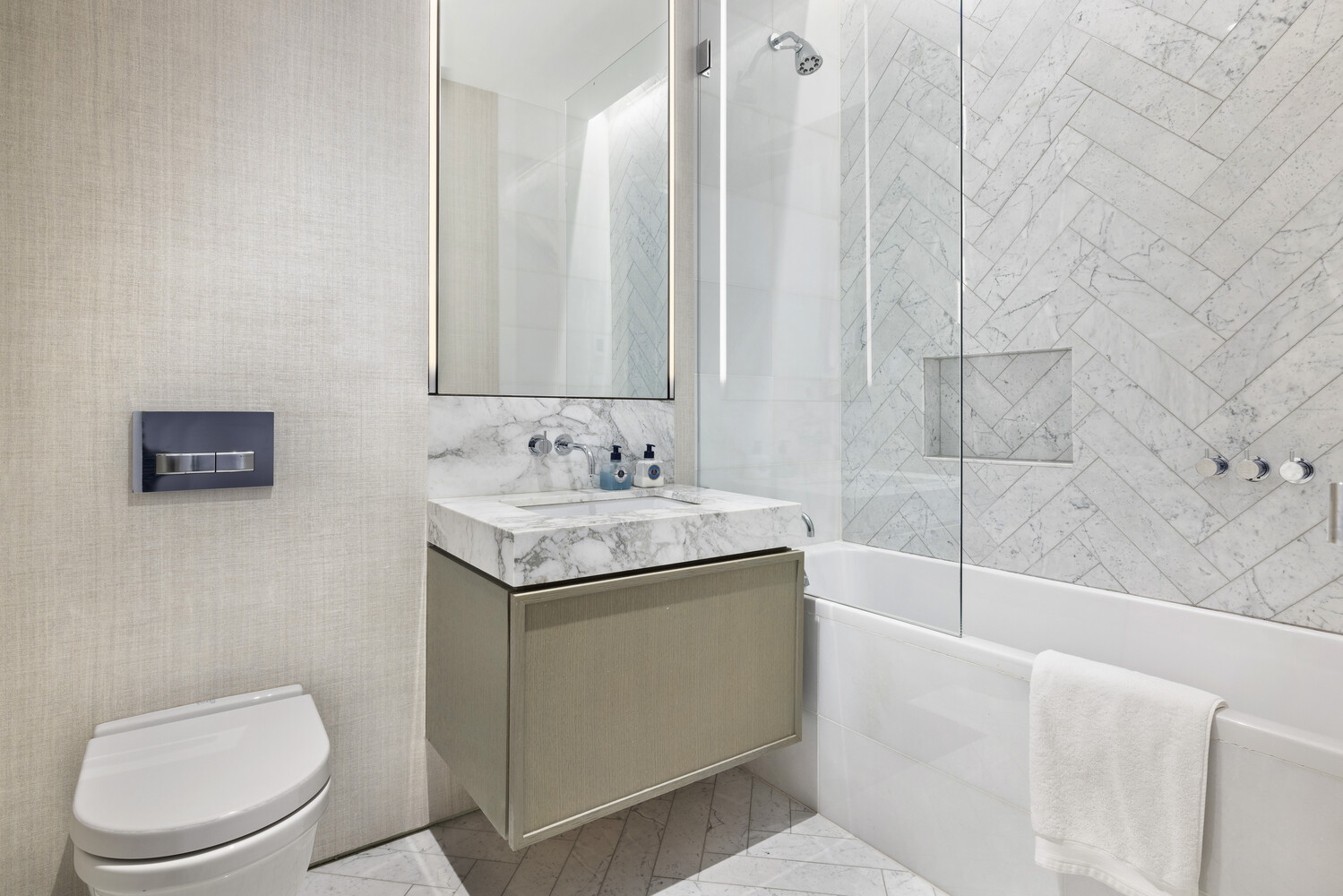 25 Mercer Street, Unit PH Manhattan, NY 10013 - Photo 18 of 20 a bathroom with a granite countertop sink a toilet and bathtub