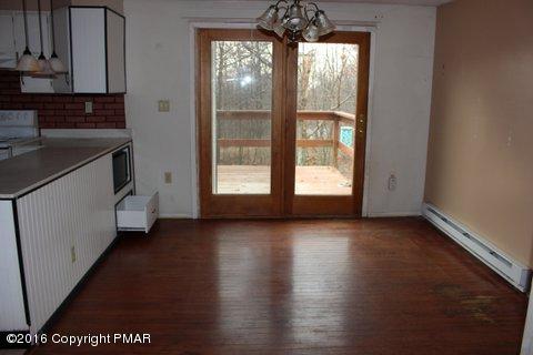 1612 Silver Maple Road Effort, PA 18330 - Photo 17 of 27 an empty room with wooden floor and windows