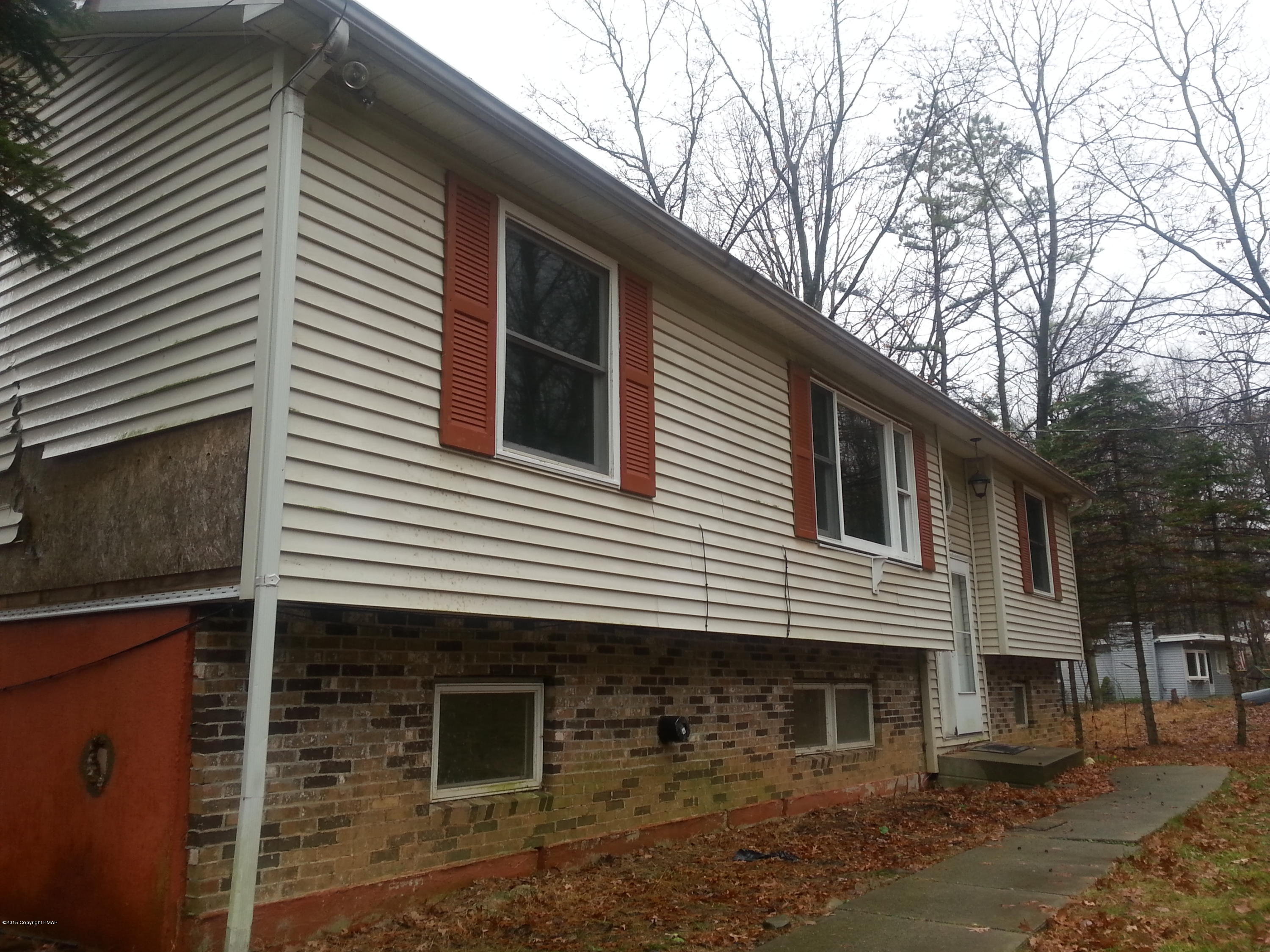 1612 Silver Maple Road Effort, PA 18330 - Photo 3 of 27 a view of a house with a yard and large tree