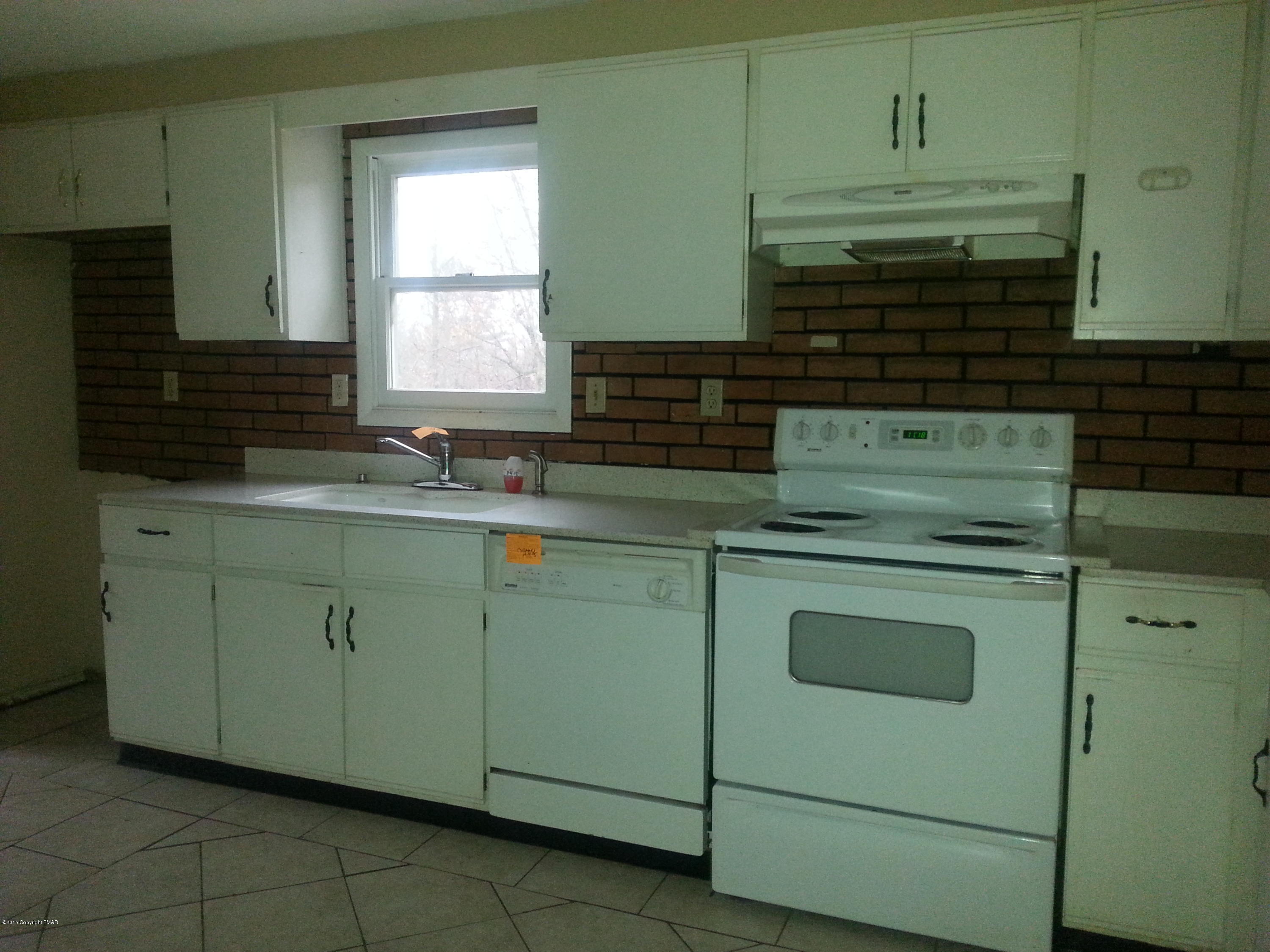 1612 Silver Maple Road Effort, PA 18330 - Photo 10 of 27 a kitchen with cabinets appliances and a sink