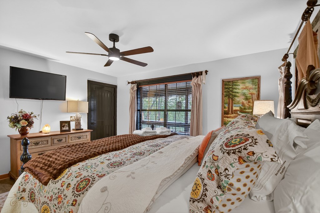329 Robinson Thomas Road Morganton, GA 30560 - Photo 29 of 96 a bedroom with a bed and a flat screen tv