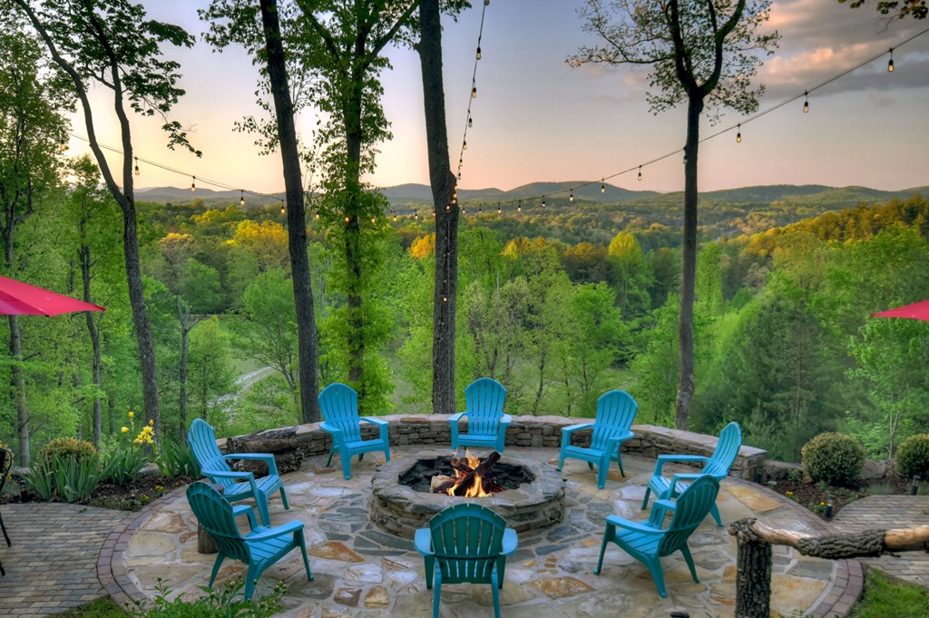 329 Robinson Thomas Road Morganton, GA 30560 - Photo 69 of 96 a backyard of a house with a fountain table and chairs