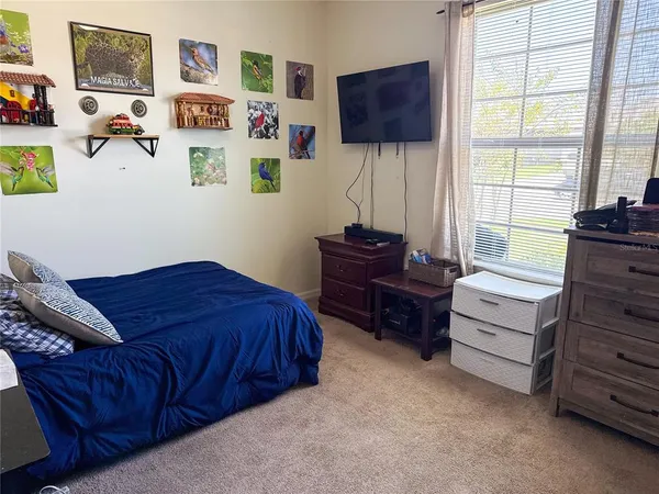 a bathroom with a sink a toilet and shower curtain