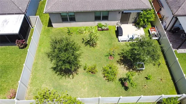 aerial view of a house with a yard