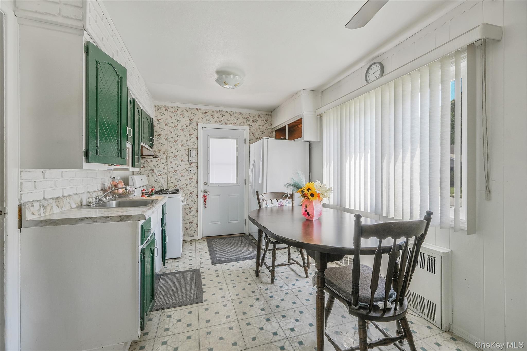 59 Maybrook Road North Babylon, NY 11703 - Photo 9 of 43 a view of a kitchen area with furniture and window