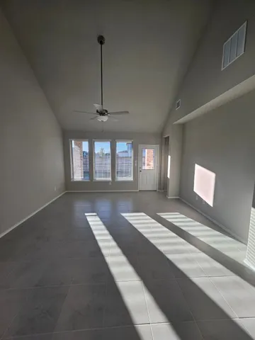 a view of spacious bedroom with a bed and glass door