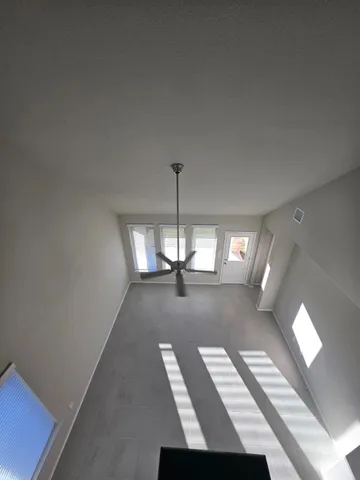 a view of livingroom with hardwood floor and a ceiling fan