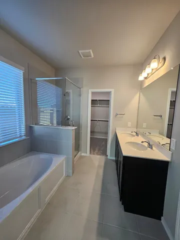 a stove top oven sitting inside of a kitchen
