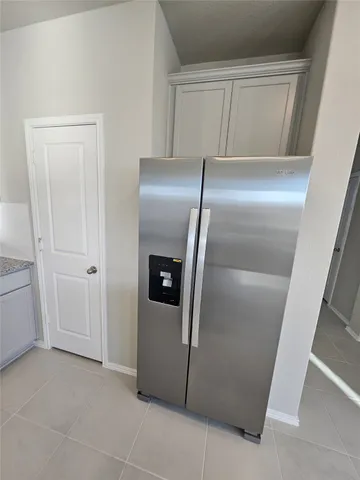 a large kitchen with kitchen island granite countertop a large counter top stainless steel appliances and cabinets