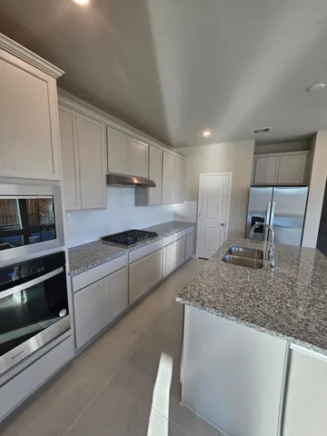 a en suite bathroom with a sink and a bathtub