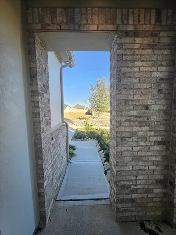 a view of a pathway door an empty space