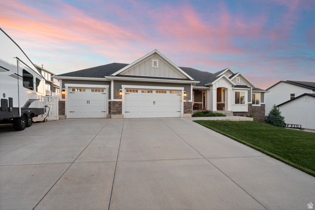 1145 North Christley Lane, Unit 48 Elk Ridge, UT 84651 - Photo 27 of 38 Contemporary single-story residence with a multi-car driveway, attached garage, and stone accents