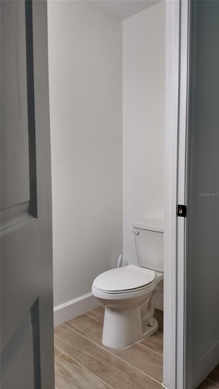 8599 Sportsman Loop Groveland, FL 34736 - Photo 11 of 19 a white toilet sitting next to a shower