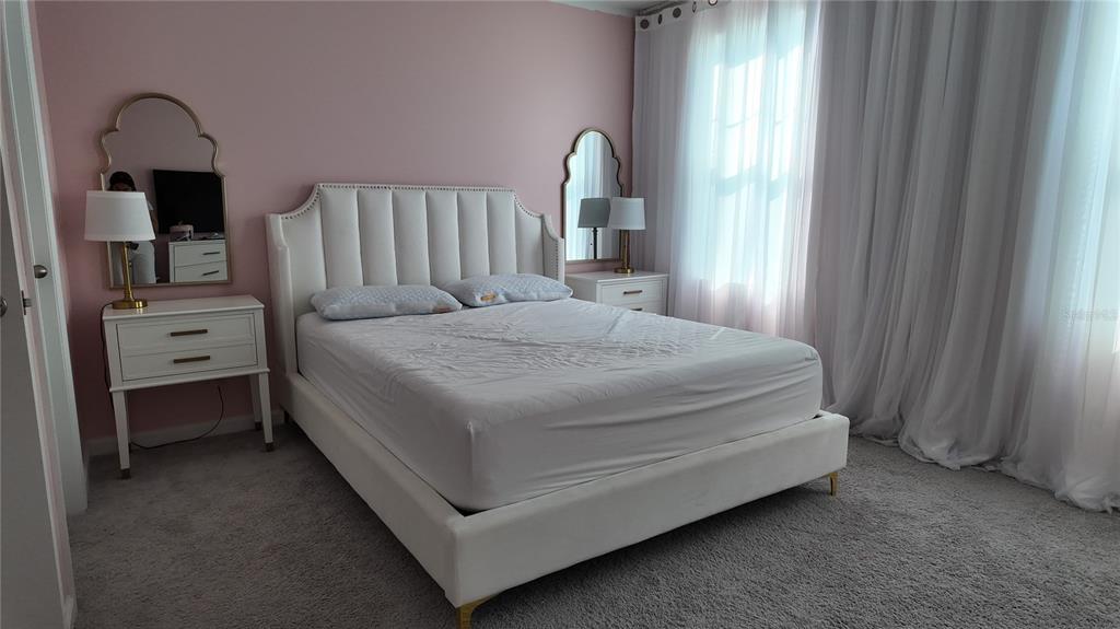 8599 Sportsman Loop Groveland, FL 34736 - Photo 16 of 19 a bedroom with a bed and a closet