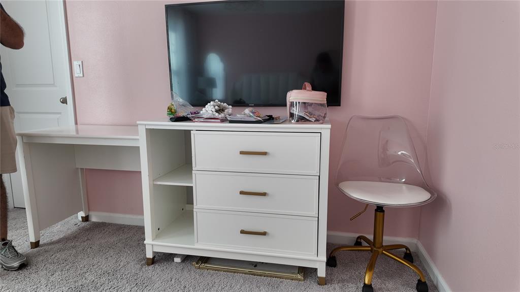 8599 Sportsman Loop Groveland, FL 34736 - Photo 18 of 19 a bathroom with a sink and a mirror