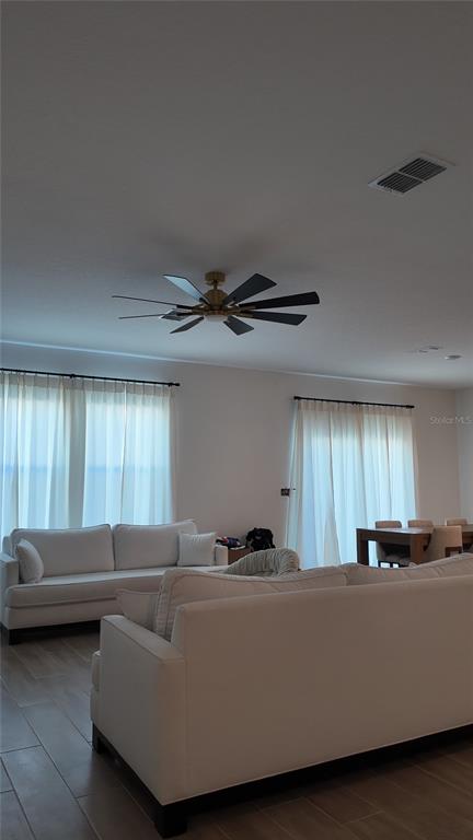 8599 Sportsman Loop Groveland, FL 34736 - Photo 4 of 19 a living room with furniture and a window