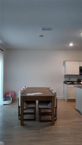 a room with furniture and a wooden floor