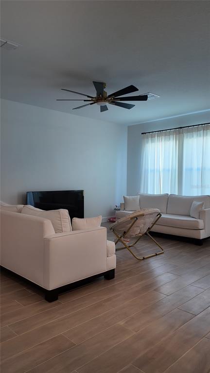 8599 Sportsman Loop Groveland, FL 34736 - Photo 10 of 19 a living room with furniture and a window