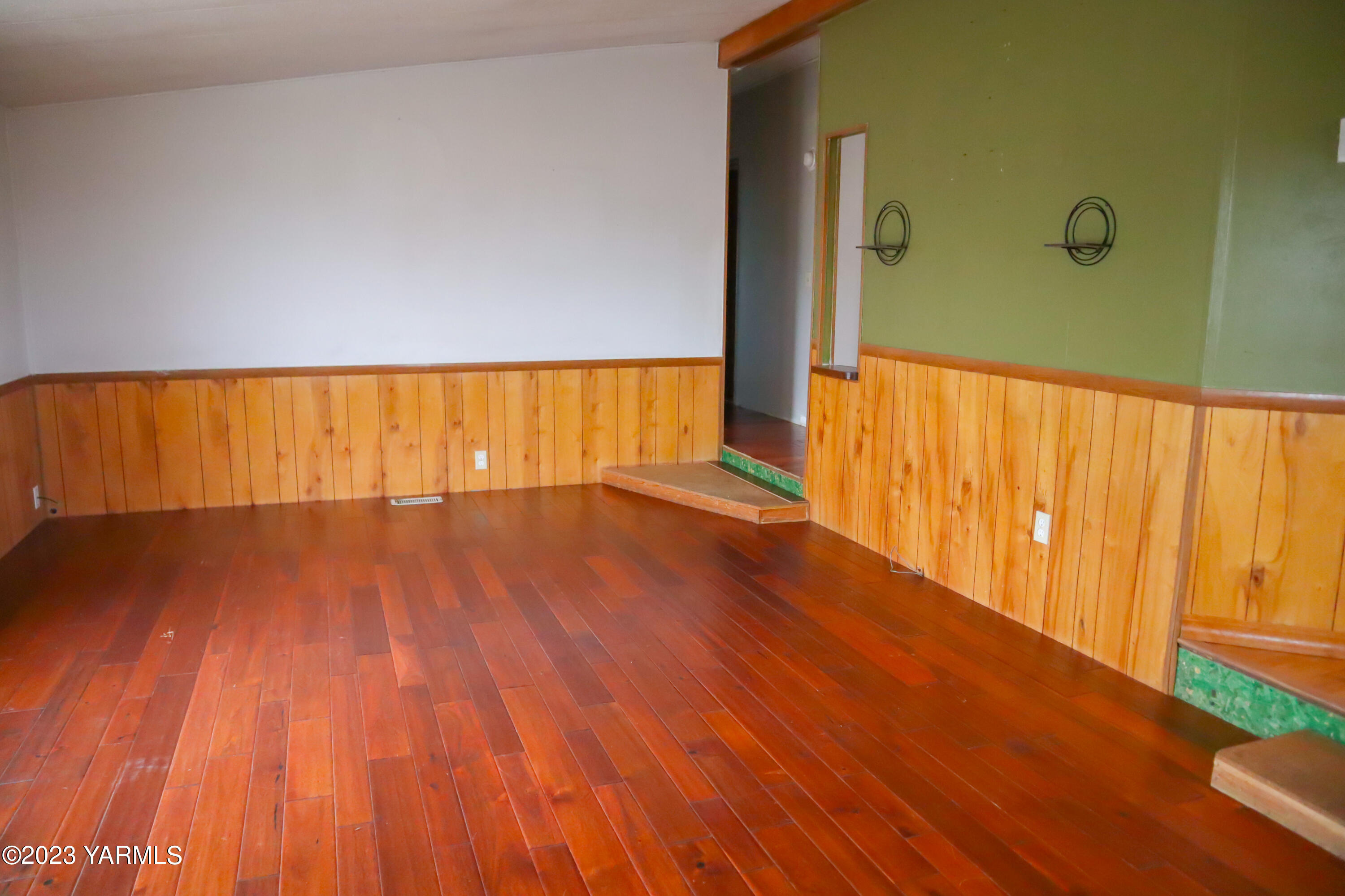 211 Cook Road Yakima, WA 98908 - Photo 5 of 23 a view of wooden floor and brick walls
