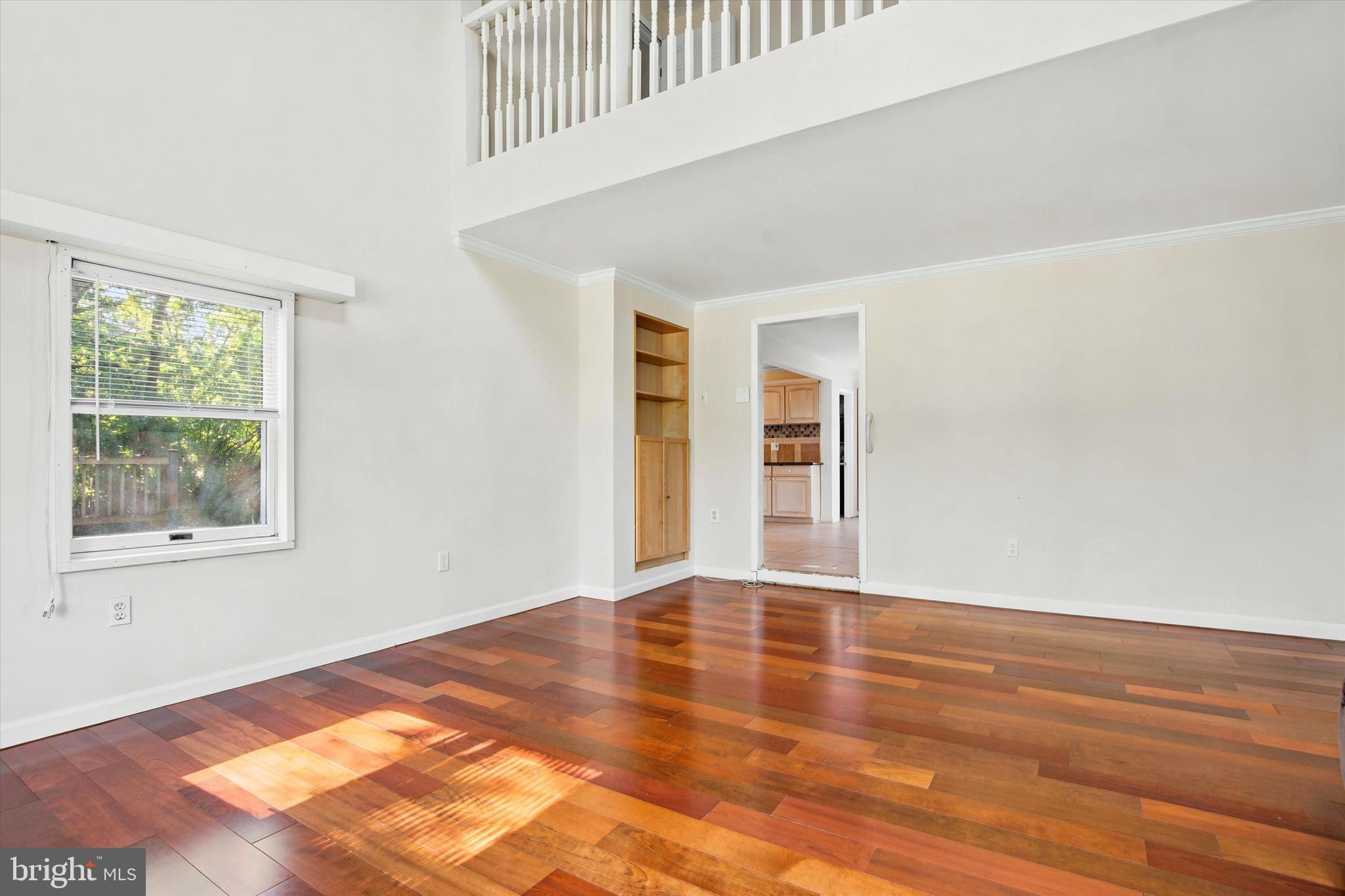 1167 Cushmore Road Southampton, PA 18966 - Photo 8 of 25 a view of an empty room with wooden floor and a window