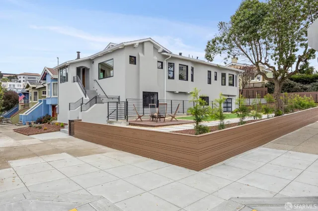 an aerial view of residential house with outdoor space and parking