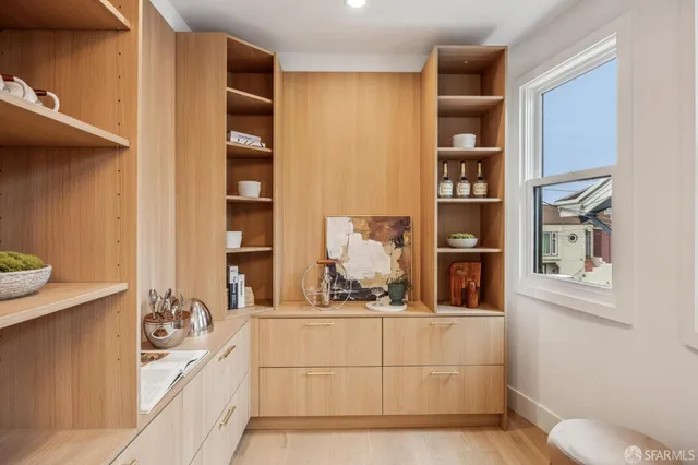 a living room with furniture and kitchen view