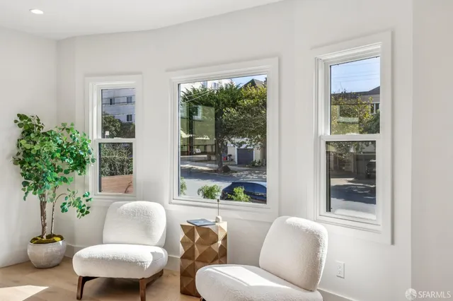 a bedroom with a bed and a chair