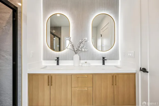 a bathroom with a toilet sink and mirror