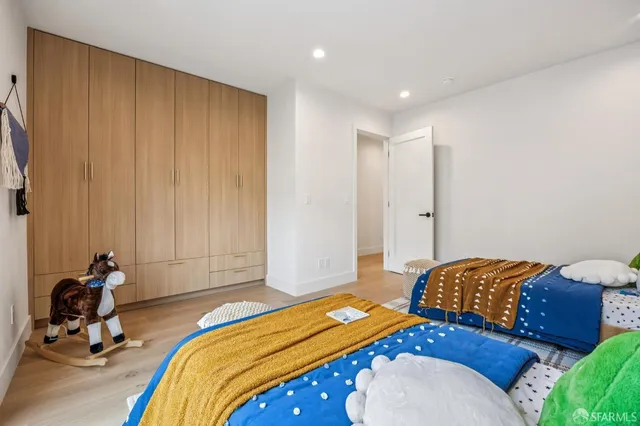 a bedroom with a bed and a table